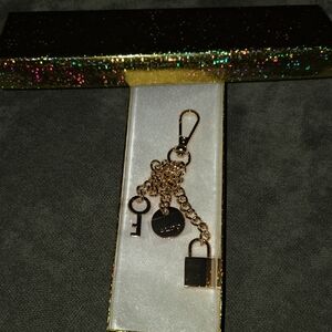 Aldo Gold and Black Charm Key Holder